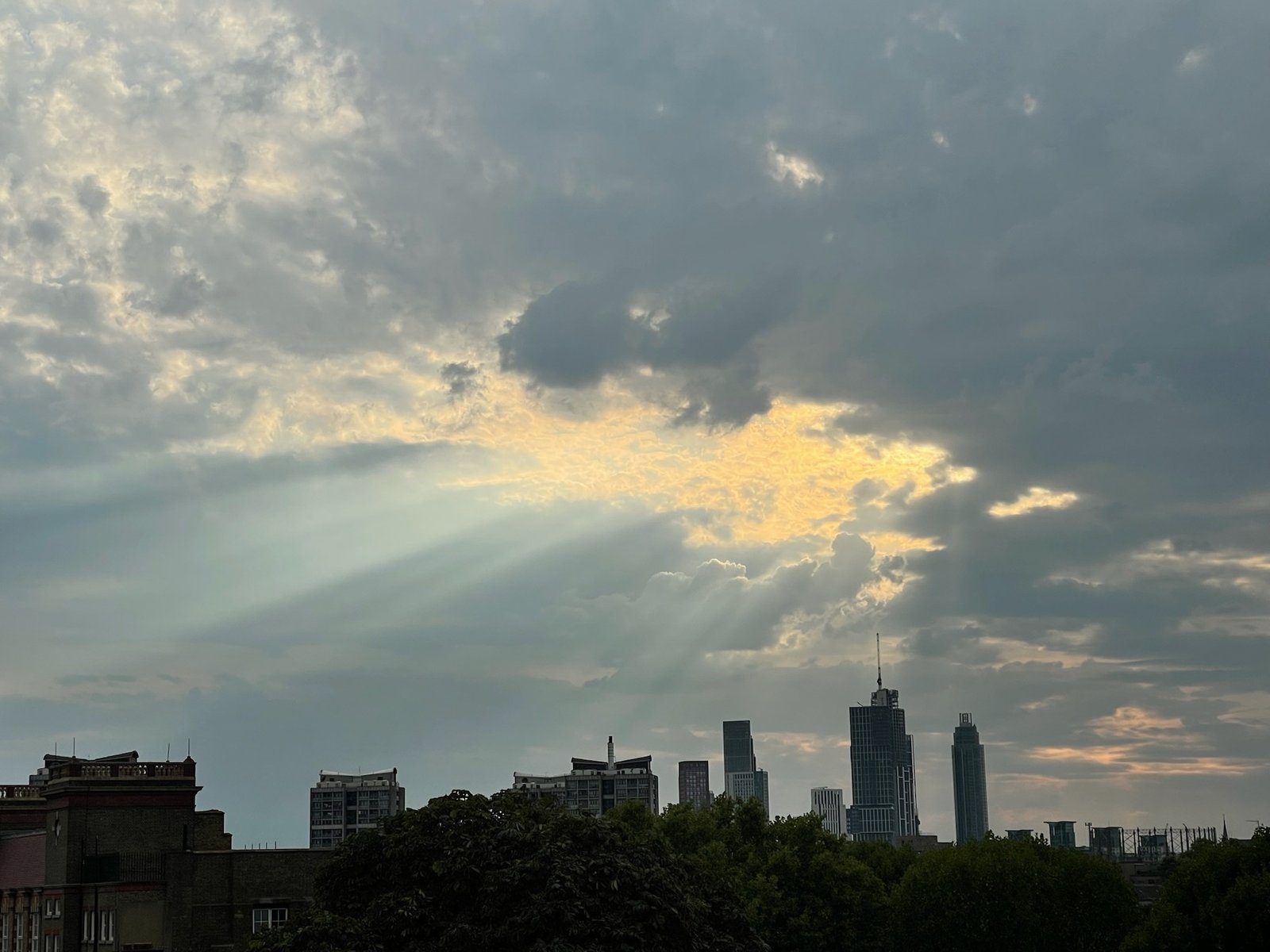 Crepuscular rays through cloud over the City of London